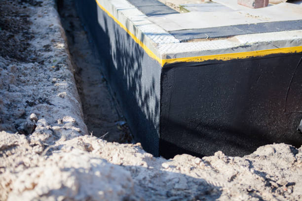 Professional Basement Waterproofing technician working in Clinton, NY
